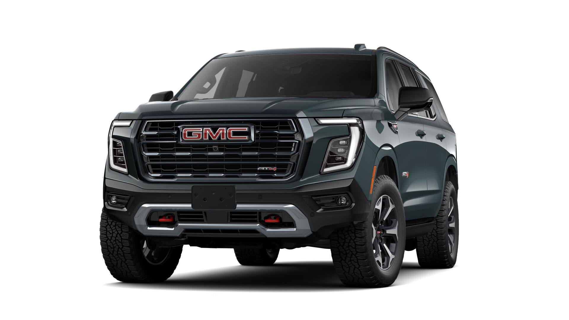 2026 GMC Yukon Base in Midnight Pine — front three-quarter view